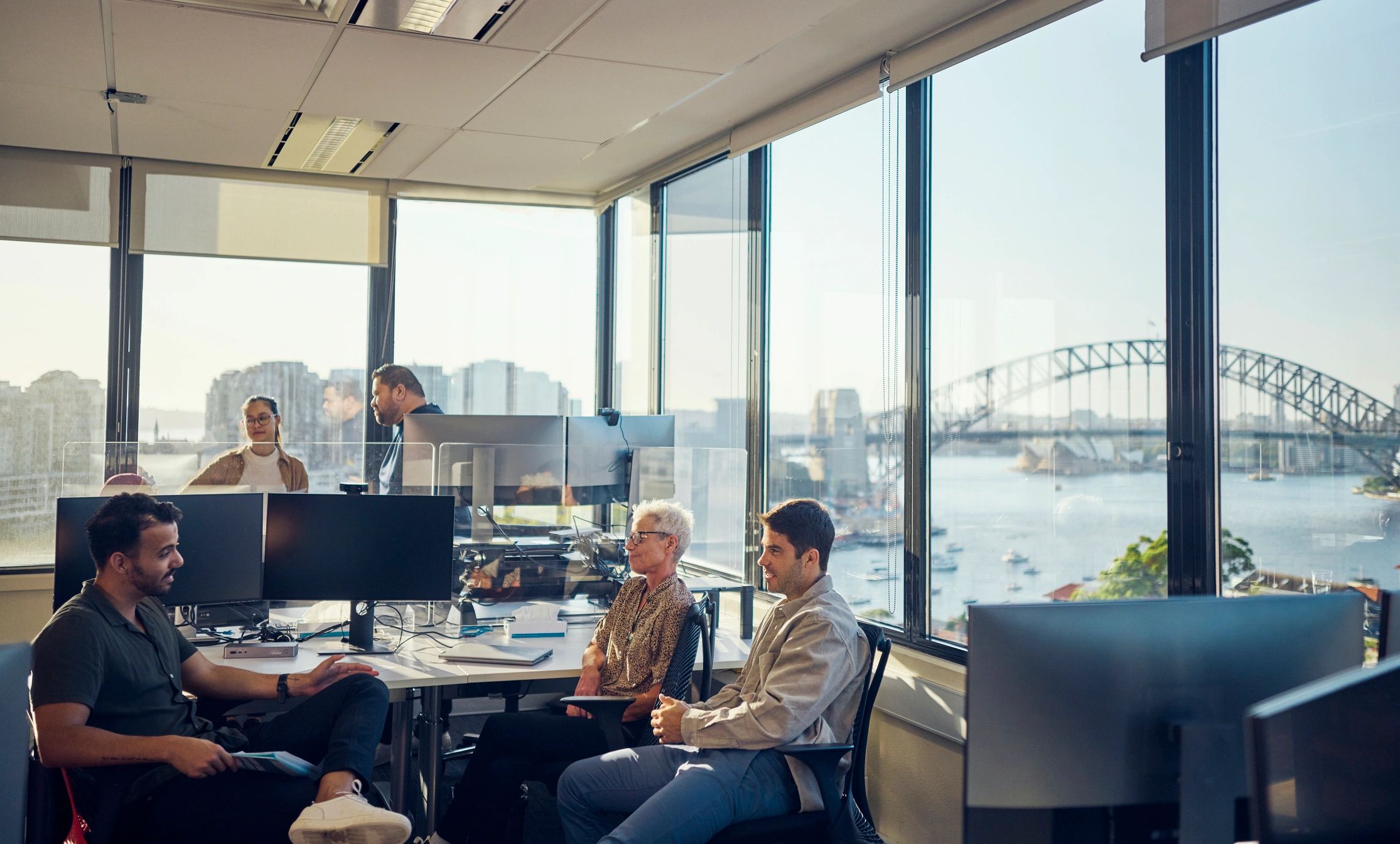 Software professionals collaborating in a modern office