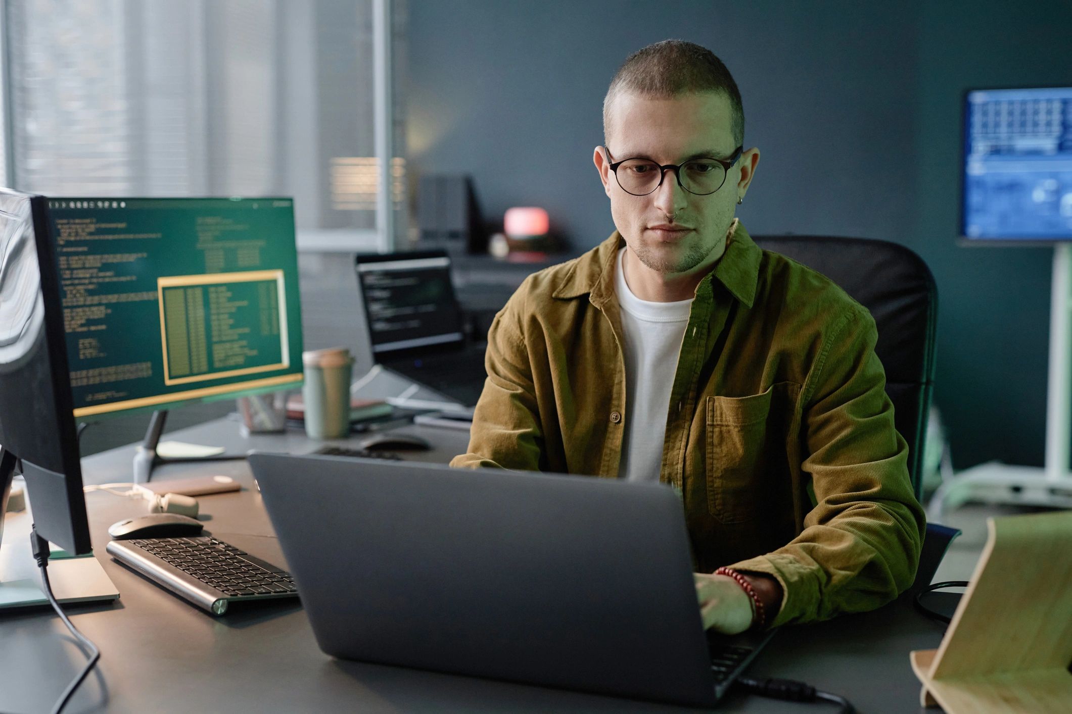 QA consultant reviewing software quality metrics on a laptop
