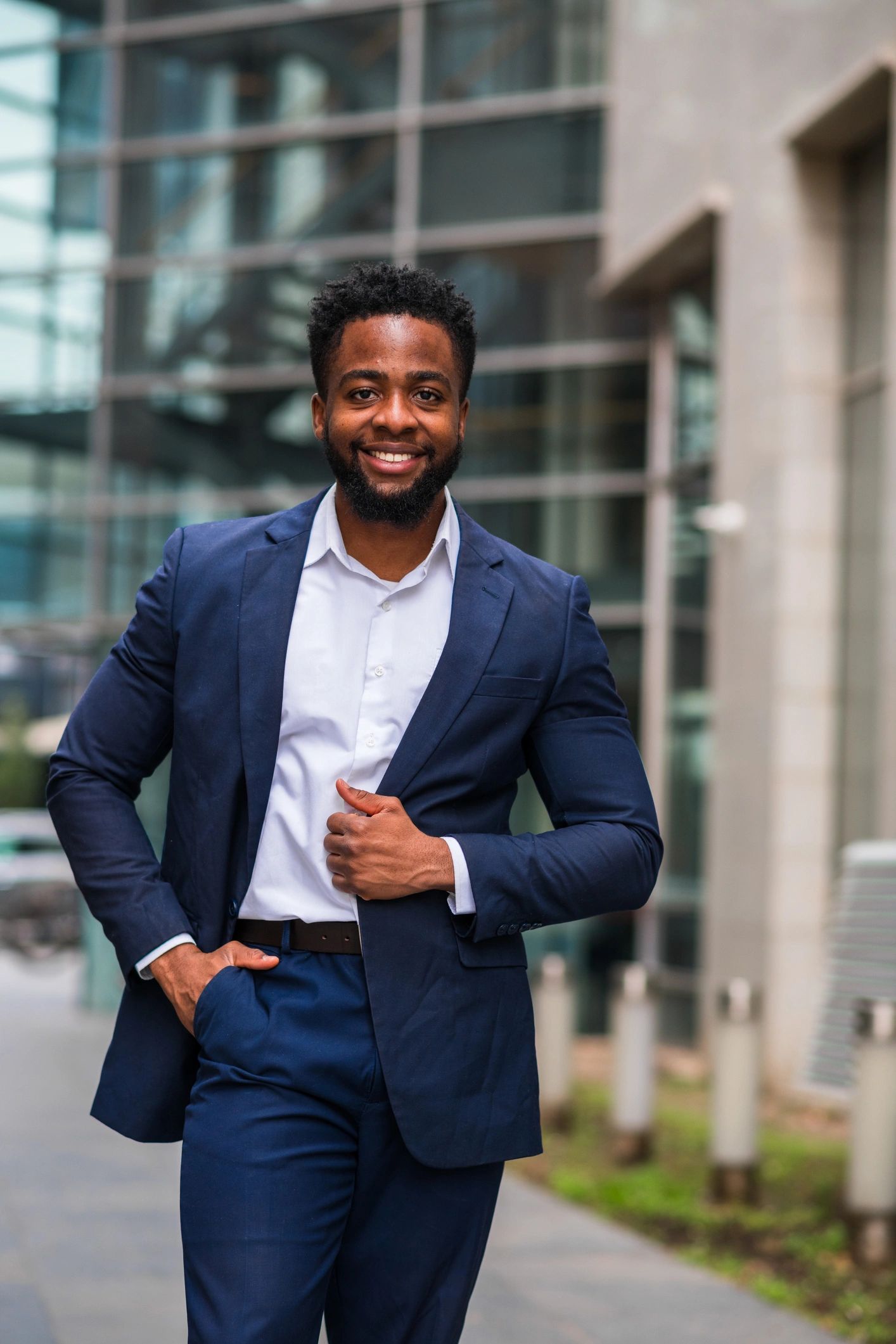 Young Black professional walking confidently in a business district